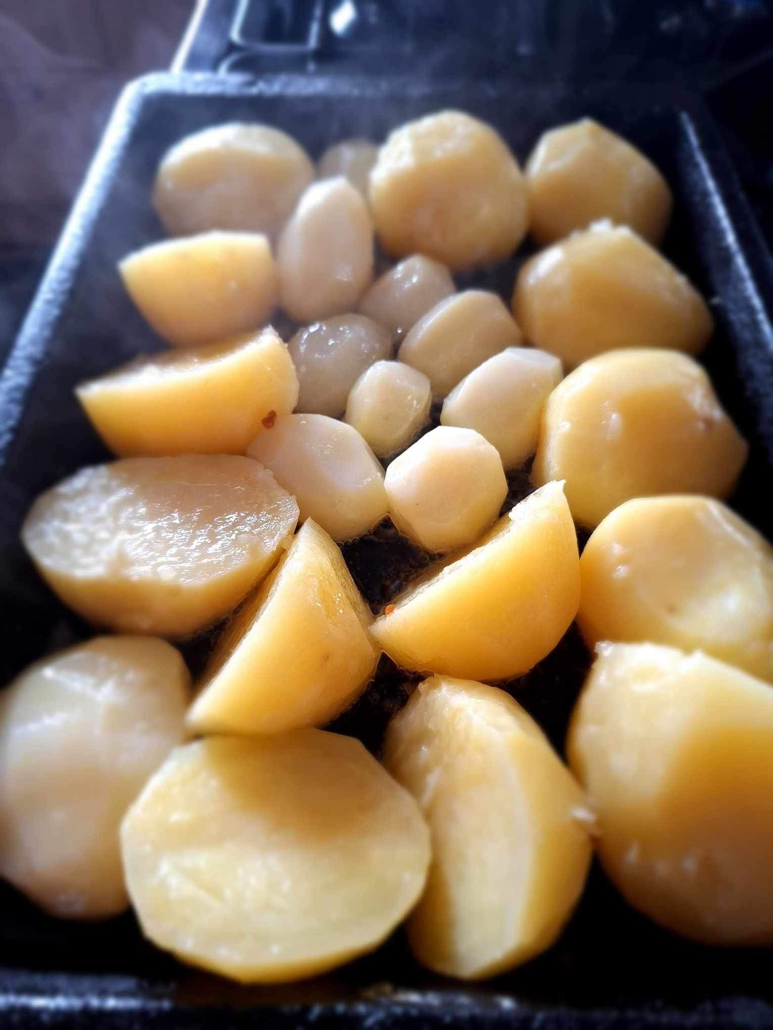 Golden crispy roast potatoes with fluffy centres cooked in goose fat for traditional Sunday roast