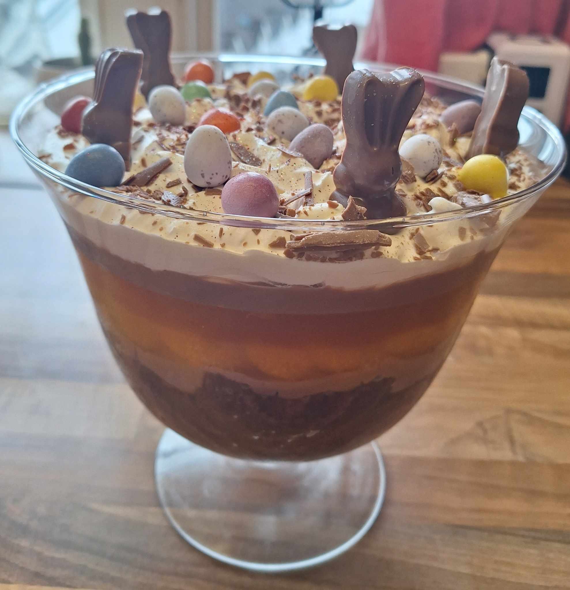 A delicious Chocolate Orange Trifle with layers of chocolate cake, orange-flavoured custard, and whipped cream.