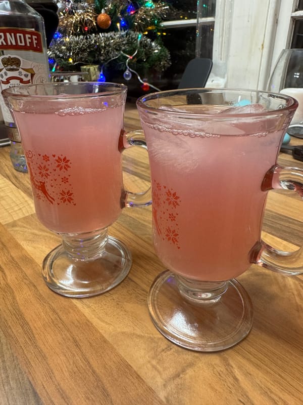 Christmas Mule cocktails in festive glasses with snowflake designs.