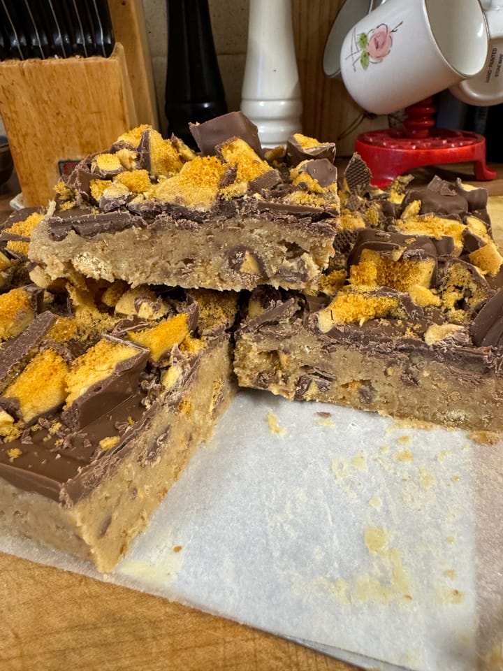 Chocolate and honeycomb bars on a cutting board, a delicious treat for any sweet tooth!